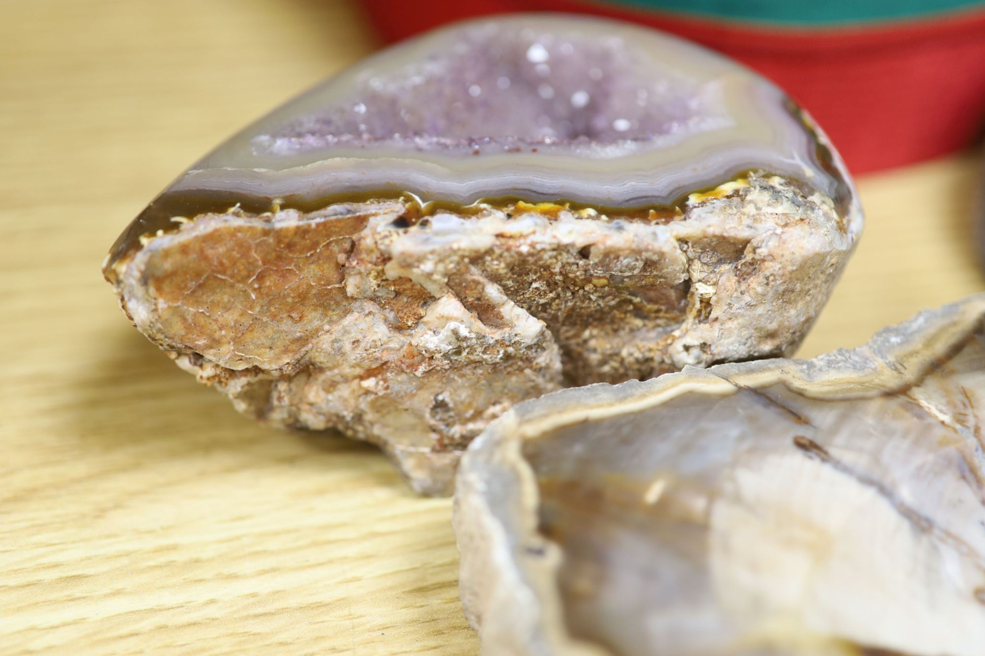 An amethyst geode section and assorted mineral specimens